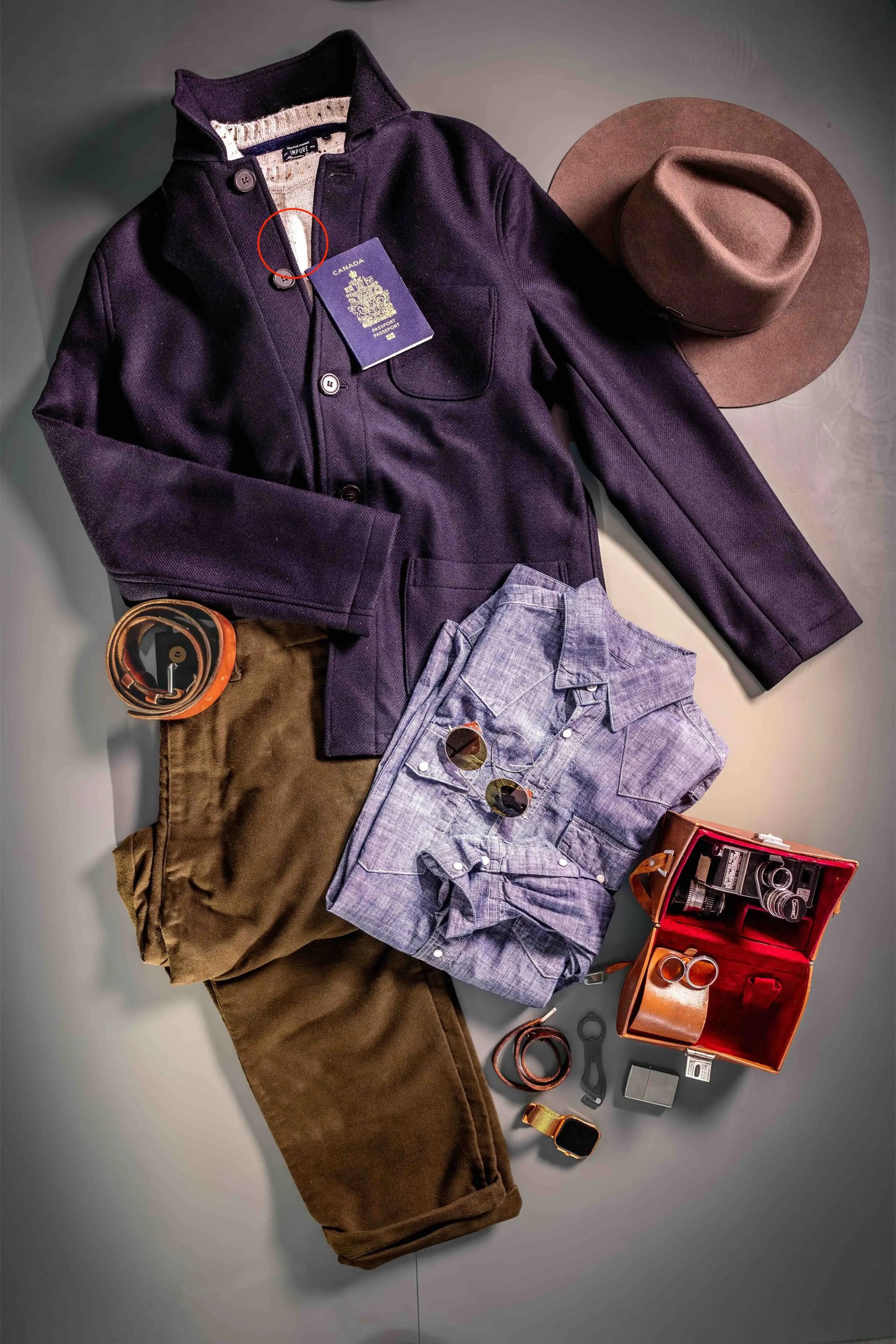 HANK menswear and travel accessories arranged on a table